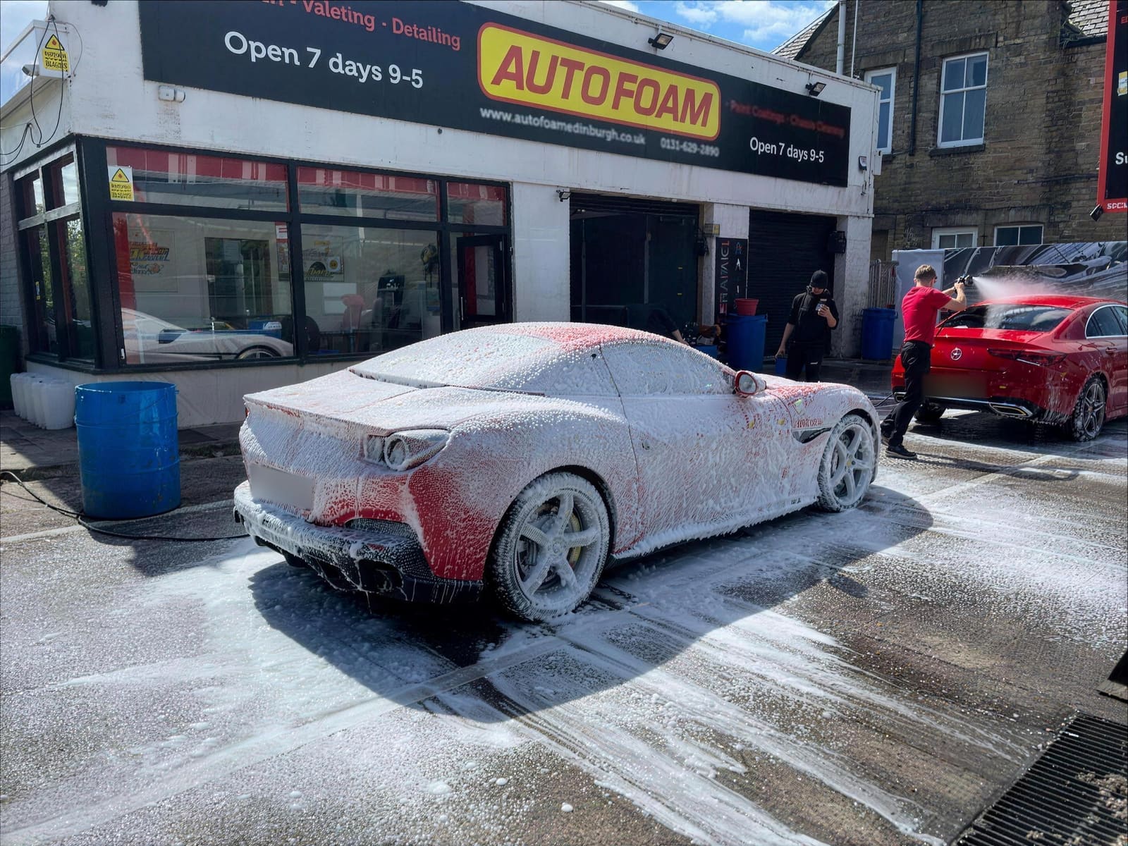 Ferrari under snow foam outside Autofoam