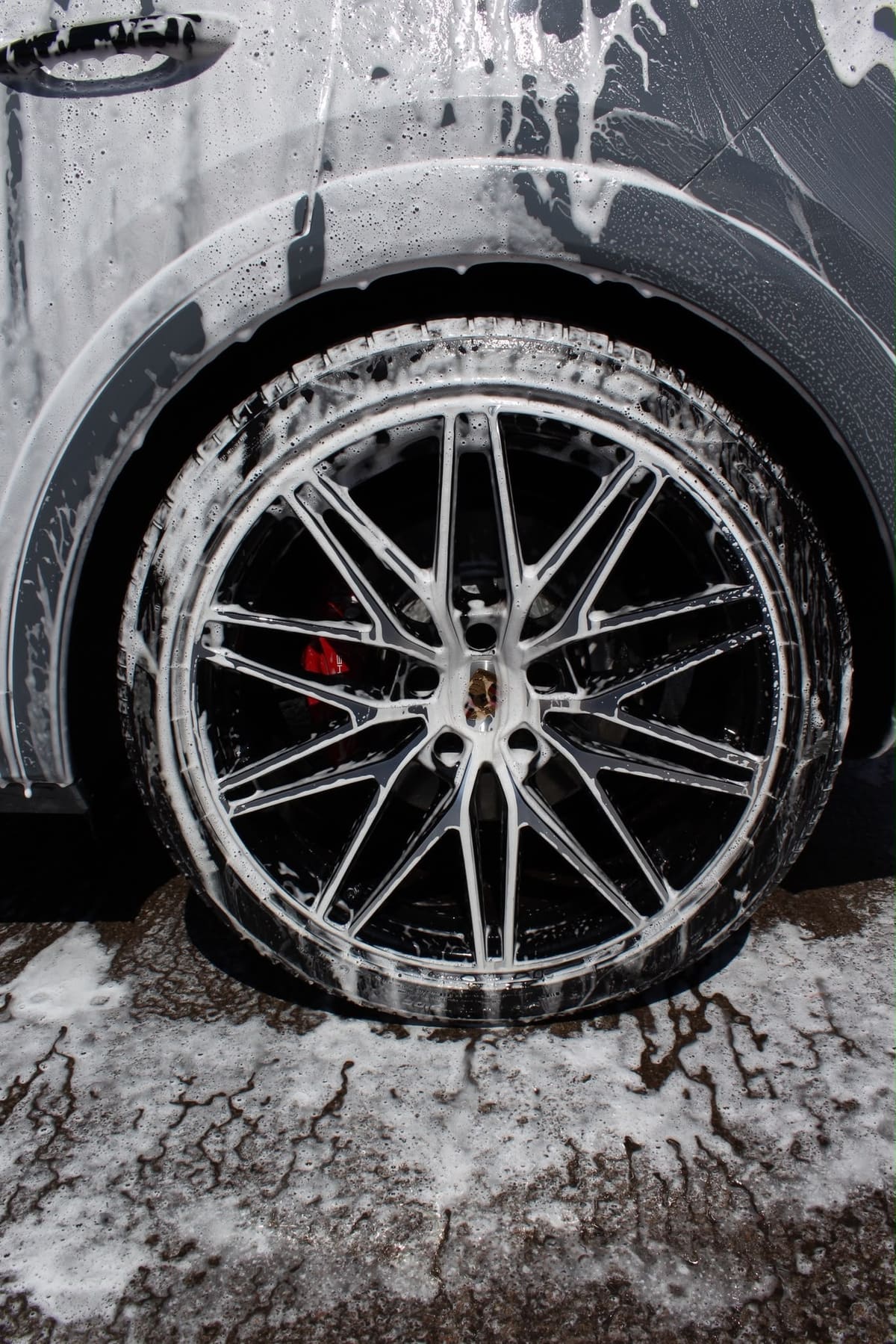 A foam-covered alloy wheel with a red brake caliper